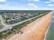 Coastal community with beach access, showcasing homes along the ocean and lush green spaces at 3817 Islamorada Dr, Ormond Beach, FL 32176
