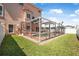View of the pool and patio area surrounded by a screen enclosure in the backyard, providing a private retreat at 3817 Islamorada Dr, Ormond Beach, FL 32176