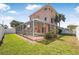 Landscaped backyard with a screened-in pool and covered patio, perfect for outdoor entertaining and relaxation at 3817 Islamorada Dr, Ormond Beach, FL 32176
