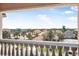 A balcony view of a lovely neighborhood with red-tiled roofs, lush palm trees, and glimpses of the distant ocean at 3817 Islamorada Dr, Ormond Beach, FL 32176
