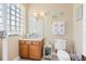 Well-appointed bathroom with modern fixtures, a vanity, and a decorative mirror at 3817 Islamorada Dr, Ormond Beach, FL 32176