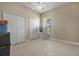 Spacious bedroom featuring neutral walls, tile floors, a ceiling fan, and large closets for plenty of storage at 3817 Islamorada Dr, Ormond Beach, FL 32176