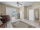 Bright bonus room features tile flooring, bar, ceiling fan, and sliding doors to the outdoor pool at 3817 Islamorada Dr, Ormond Beach, FL 32176