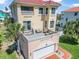 Side view of the home exterior featuring a rooftop deck and garage at 3817 Islamorada Dr, Ormond Beach, FL 32176