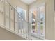 Bright foyer with lots of natural light and a staircase leading to upper floors at 3817 Islamorada Dr, Ormond Beach, FL 32176