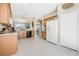 Spacious kitchen featuring tile floors, wooden cabinets, modern appliances, and arched doorway access to living space at 3817 Islamorada Dr, Ormond Beach, FL 32176