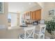 Kitchen breakfast bar featuring tile countertops, seating, lighting, and view to exterior at 3817 Islamorada Dr, Ormond Beach, FL 32176
