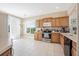 Bright kitchen with stainless steel appliances, ample cabinet space, and adjacent dining area at 3817 Islamorada Dr, Ormond Beach, FL 32176