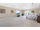 A spacious main bedroom with large windows, neutral walls, carpeted floors, and a ceiling fan at 3817 Islamorada Dr, Ormond Beach, FL 32176