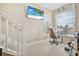 Bright office features stairway access, tile flooring, natural light from dual windows, and beach decor at 3817 Islamorada Dr, Ormond Beach, FL 32176