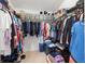 A fully stocked walk-in closet with ample hanging space, shelving, and storage solutions at 3817 Islamorada Dr, Ormond Beach, FL 32176