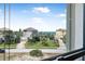 A lovely view of a coastal community from a window overlooking meticulously landscaped properties and a glimpse of the ocean at 3817 Islamorada Dr, Ormond Beach, FL 32176