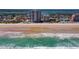 Aerial view of a beachfront condo building, revealing its proximity to the ocean and highlighting beachfront access at 3855 S Atlantic Ave # 405, Daytona Beach, FL 32118