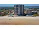Stunning aerial view of beachfront condo building with private beach access and pool at 3855 S Atlantic Ave # 405, Daytona Beach, FL 32118