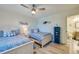 Well-lit bedroom with matching twin beds, nautical decor, and an ensuite bathroom at 3855 S Atlantic Ave # 405, Daytona Beach, FL 32118