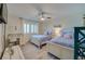 Charming bedroom with matching twin beds, a desk, and nautical decor at 3855 S Atlantic Ave # 405, Daytona Beach, FL 32118