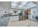 Bright kitchen featuring stainless steel appliances, granite countertops and lots of storage at 3855 S Atlantic Ave # 405, Daytona Beach, FL 32118