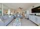 Cozy living room with ample seating, bright decor, and open access to the dining and kitchen areas at 3855 S Atlantic Ave # 405, Daytona Beach, FL 32118