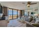 Bright living room with expansive ocean views, comfortable seating, and a sliding glass door to balcony at 3855 S Atlantic Ave # 405, Daytona Beach, FL 32118