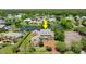 Expansive waterfront property featuring a brick home with mature trees and verdant landscaping at 4 Huntsman Look, Ormond Beach, FL 32174