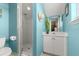 Stylish bathroom with a glass-enclosed shower, white vanity with sink, and coastal-inspired décor at 4 Huntsman Look, Ormond Beach, FL 32174