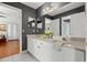 Bathroom featuring dual sinks, mirrors, and gray walls at 4 Huntsman Look, Ormond Beach, FL 32174