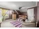 Cozy bedroom featuring a sloped ceiling, neutral carpeting, ceiling fan, and natural light at 4 Huntsman Look, Ormond Beach, FL 32174