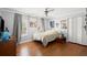 Bright bedroom featuring hardwood floors, neutral walls, natural light, and a ceiling fan at 4 Huntsman Look, Ormond Beach, FL 32174
