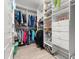 Spacious walk-in closet with custom shelving, drawers, and ample hanging space for organized storage at 4 Huntsman Look, Ormond Beach, FL 32174
