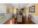 Charming dining room with wainscoting, chandelier, and a large table perfect for gatherings at 4 Huntsman Look, Ormond Beach, FL 32174
