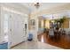 Inviting foyer leading to a formal dining room with elegant chandelier and traditional decor at 4 Huntsman Look, Ormond Beach, FL 32174