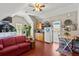 Lofted living area with hardwood floors, seating area, kitchen, and lofted ceilings at 4 Huntsman Look, Ormond Beach, FL 32174