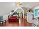 Lofted living area with hardwood floors, seating area, kitchen, and lofted ceilings at 4 Huntsman Look, Ormond Beach, FL 32174