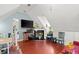Living room features a fireplace, hardwood floors, and lofted ceilings at 4 Huntsman Look, Ormond Beach, FL 32174