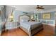 Well-lit main bedroom with a large bed, complemented by ample natural light streaming through the windows at 4 Huntsman Look, Ormond Beach, FL 32174