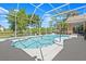Relaxing pool area with an attached hot tub, screened in with a large sundeck and outdoor seating at 4 Huntsman Look, Ormond Beach, FL 32174