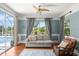 Sitting room with comfortable seating and large windows that offer scenic views of the pool and outdoor landscape at 4 Huntsman Look, Ormond Beach, FL 32174