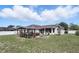 Expansive backyard with a covered patio, perfect for outdoor dining and relaxation at 417 Jeffers St, Deltona, FL 32725