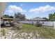 Large backyard with a gazebo, grill, privacy fence, and sparse vegetation at 417 Jeffers St, Deltona, FL 32725