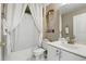 Bathroom features a shower with tub, and a modern sink at 417 Jeffers St, Deltona, FL 32725