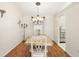 Elegant dining room with a chandelier and hardwood floors at 417 Jeffers St, Deltona, FL 32725