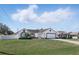 Charming single-story home with a well-maintained lawn and a two-car garage at 417 Jeffers St, Deltona, FL 32725