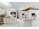 Well-lit kitchen with white cabinets, tile floors, and stainless steel appliances at 417 Jeffers St, Deltona, FL 32725
