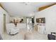 Bright living room with tile floors, white walls, and an open layout at 417 Jeffers St, Deltona, FL 32725