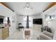 Inviting living room with a large window, tile flooring, and neutral tones at 417 Jeffers St, Deltona, FL 32725