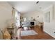 Bright living room featuring a fireplace, hardwood floors, and ample natural light at 417 Jeffers St, Deltona, FL 32725