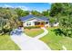 Aerial view of a home highlighting the lush greenery, pool, and driveway, presenting a peaceful setting at 426 N Boyd St, Winter Garden, FL 34787