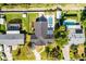 An aerial view of a well-maintained property with a backyard pool, green grass and patio area at 426 N Boyd St, Winter Garden, FL 34787