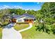 Aerial view of home with driveway, landscaping, and pool, showcasing the property's layout and features at 426 N Boyd St, Winter Garden, FL 34787