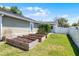 Well-maintained backyard with raised garden beds, perfect for gardening and enjoying outdoor activities at 426 N Boyd St, Winter Garden, FL 34787